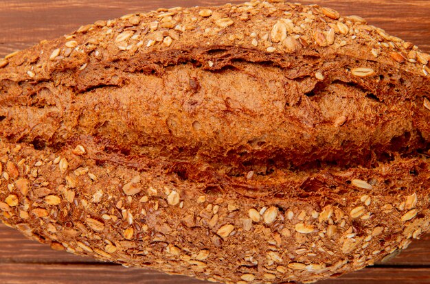 Close-up view of seeded vietnamese baguette on wooden surface