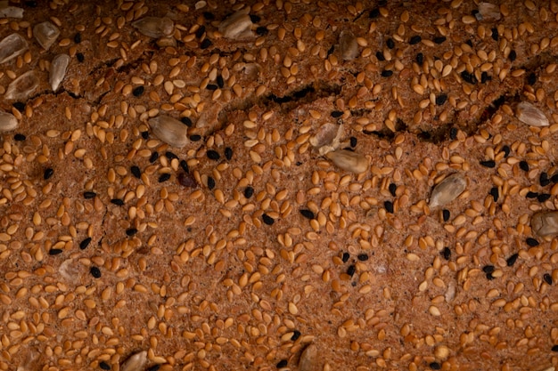 Close-up view of sunflower seeds on sandwich bread for background uses