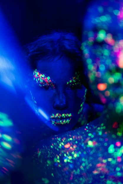 Free photo close-up view of woman with fluorescent make-up