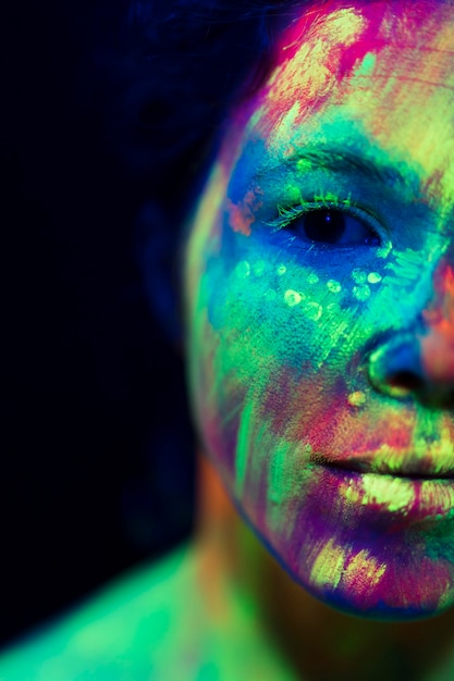 Free photo close-up view of woman with fluorescent make-up