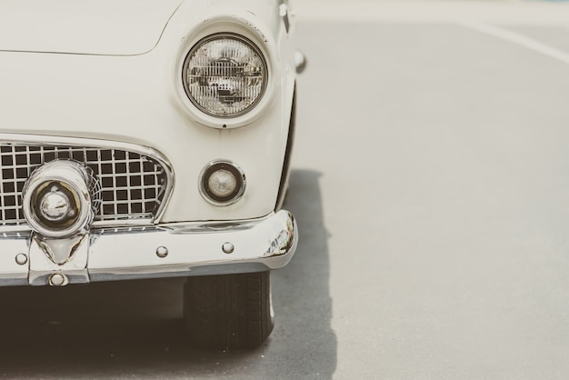 Close-up of vintage car in black and white