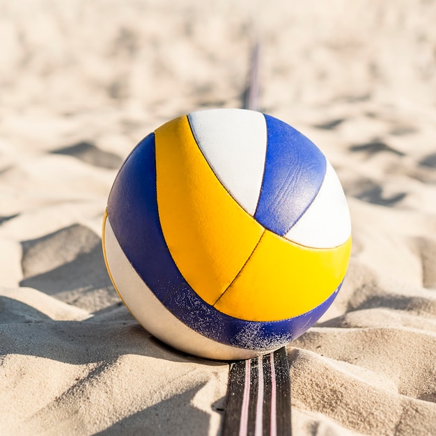 Free Photo close-up of volleyball on the beach sand