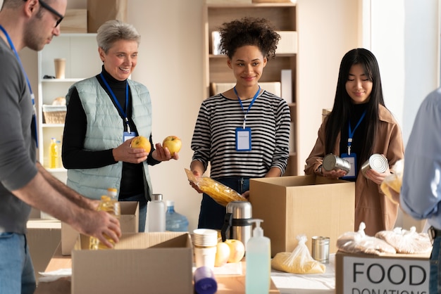 Free photo close up volunteers with food donations