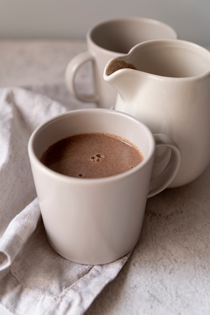 Close-up white cups of delicious coffee