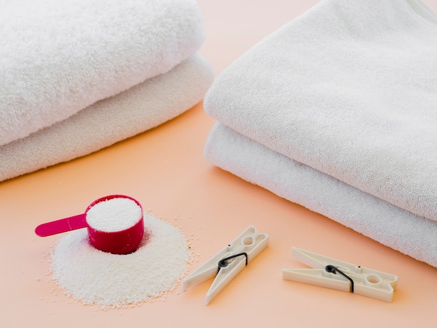 Free photo close-up white folded clean towels with clothes pin