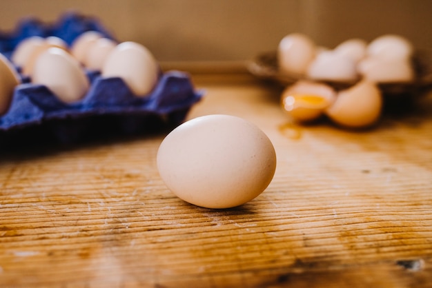 Close-up of whole egg on wooden table