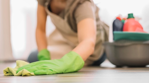 Free photo close-up woman cleaning floor