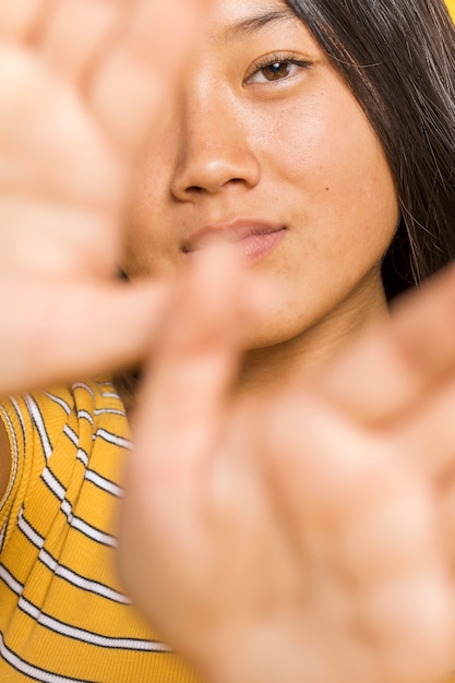 Free Photo close-up woman covering her face with hands