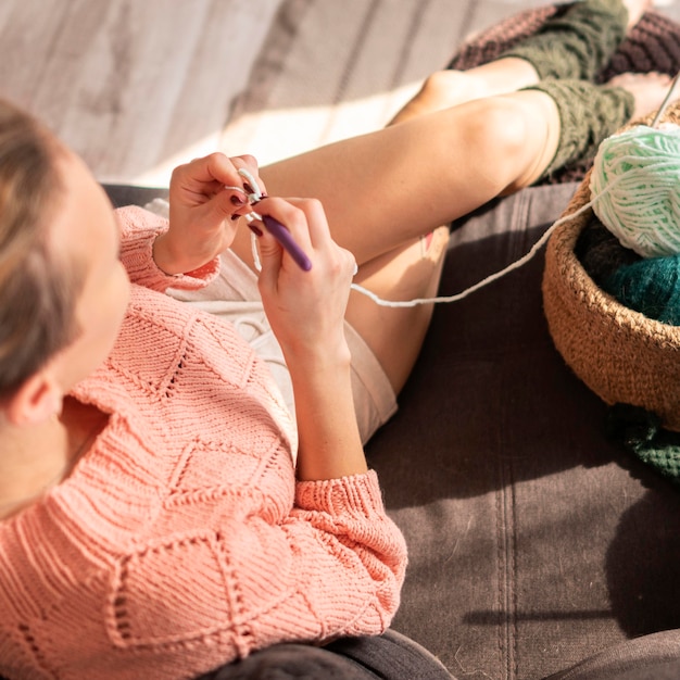 Free photo close-up woman crocheting  high angle