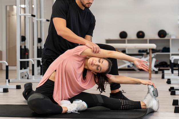 Close up woman exercising on mat