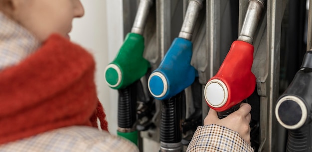 Close up woman at gas station