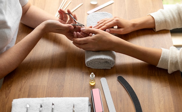 Close up woman getting manicure done