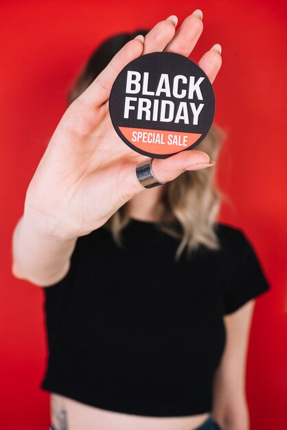 Close-up woman hand with black friday sign