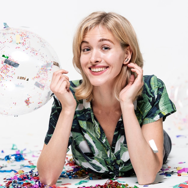 Free photo close-up woman holding a balloon