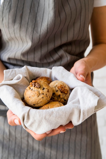 Free Photo close-up woman holding buns