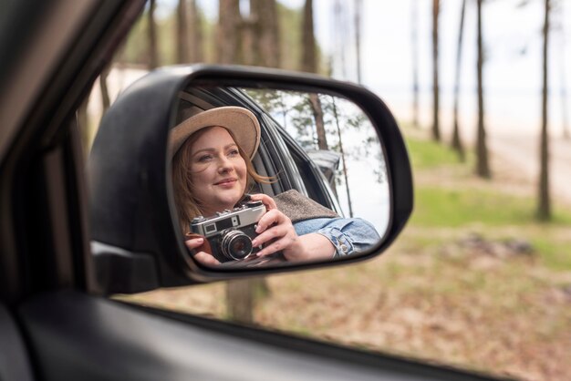 Close up woman holding camera