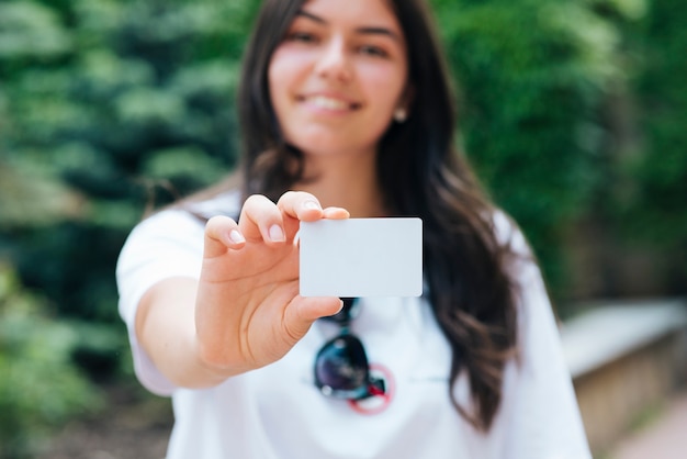 Close-up woman holding a card mock-up 