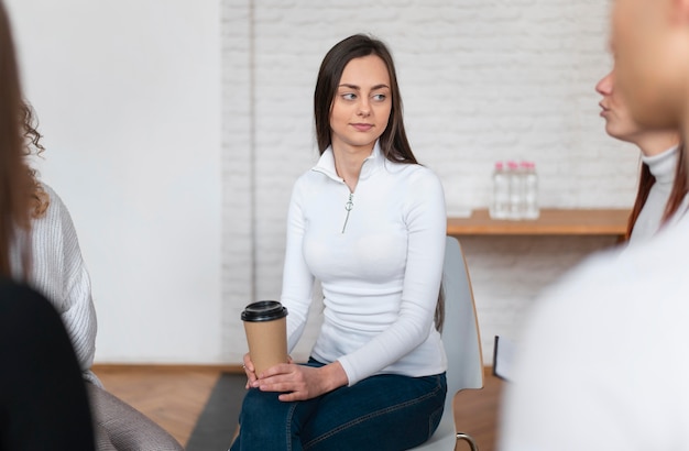 Close up woman holding coffee cup