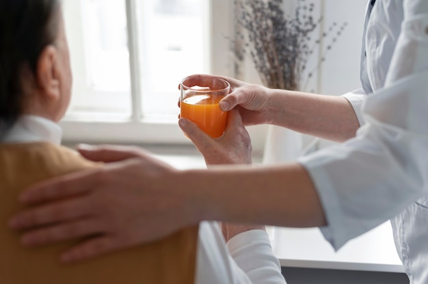 Free photo close up woman holding cup