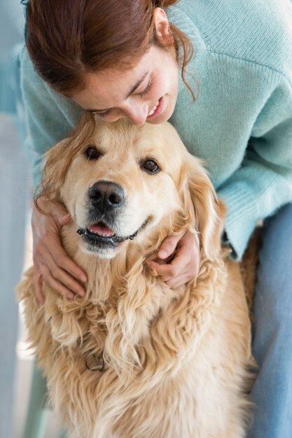 Close up woman holding cute dog