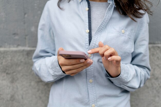 Close up woman holding device