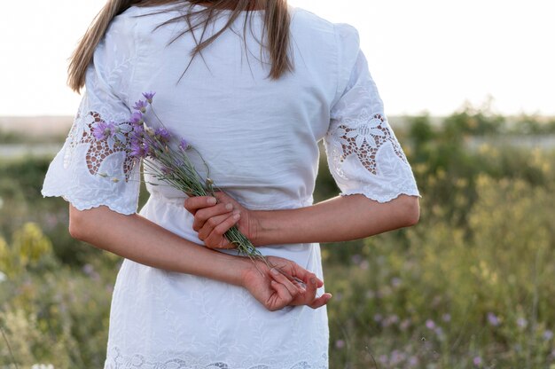 Close-up woman holding flowers bouquet