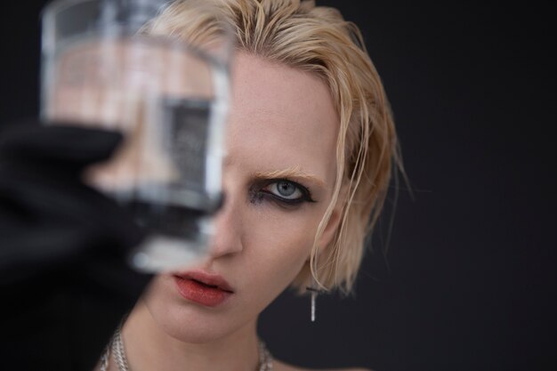 Close up woman holding glass