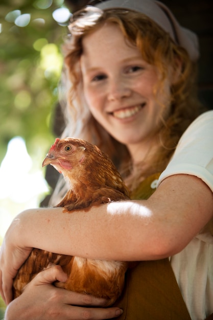 Close up woman holding hen