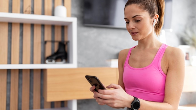 Free photo close up woman holding phone