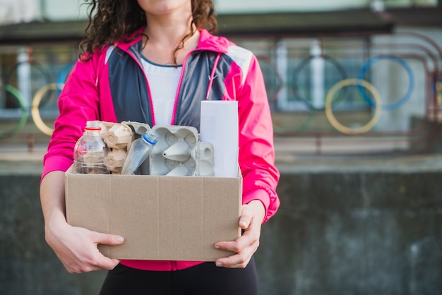 Free photo close-up of woman holding recycle cardboard box