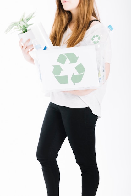 Free photo close-up of woman holding recycle rubbish crate on white background