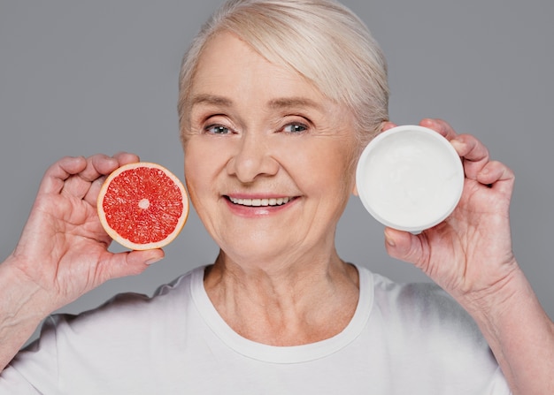 Close-up woman holding red orange and cream