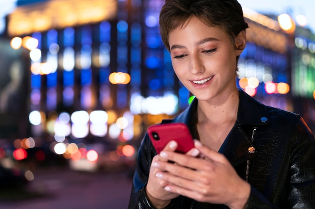 Close up woman holding smartphone