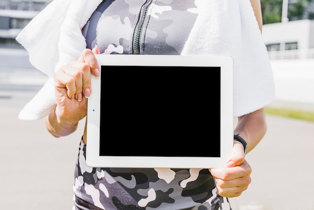 Free photo close-up of woman holding tablet mock-up