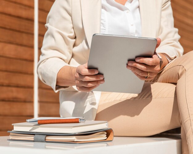 Close-up woman holding tablet