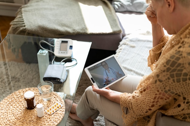 Free Photo close up woman holding tablet