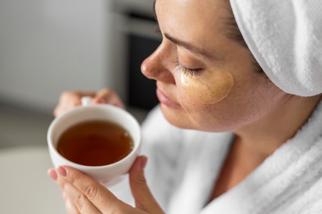 Close-up woman holding tea cup