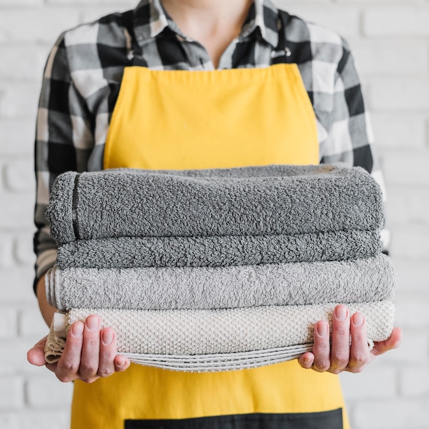 Free Photo close-up woman holding towels