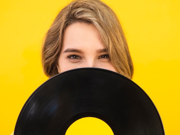 Close-up woman holding vinyl