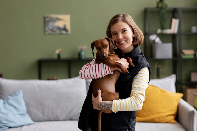 Free Photo close up on woman hugging her pet dog