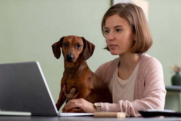 Close up on woman hugging her pet dog