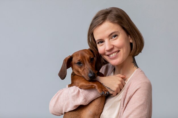 Close up on woman hugging her pet dog