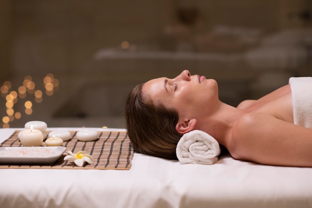 Close up woman laying on towel