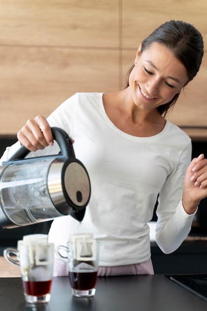 Close up on woman making coffee