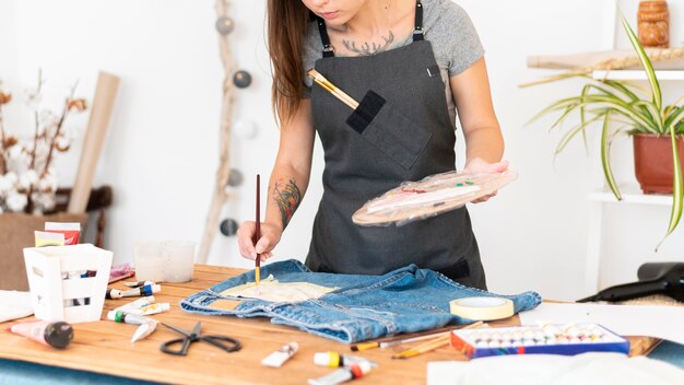 Close-up woman painting pocket