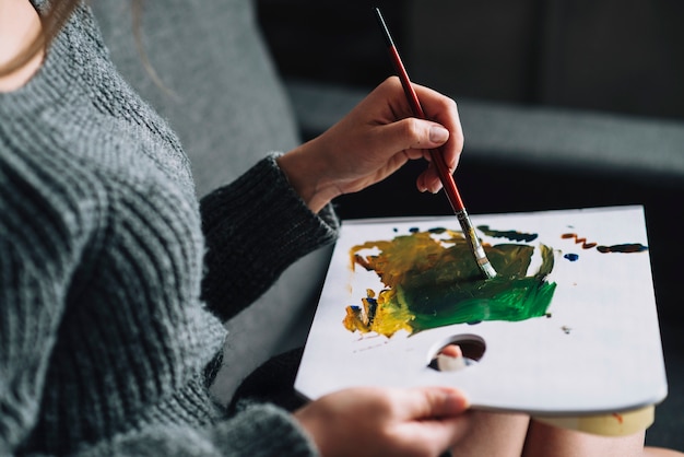 Free Photo close up of woman painting