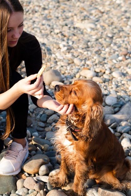 Close-up woman petting her dog