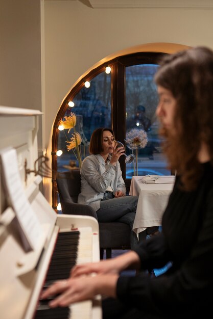 Close up woman playing the piano