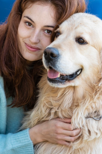 Close up woman posing with dog