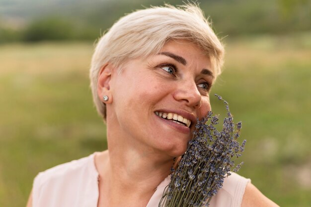 Close-up woman posing with flowers